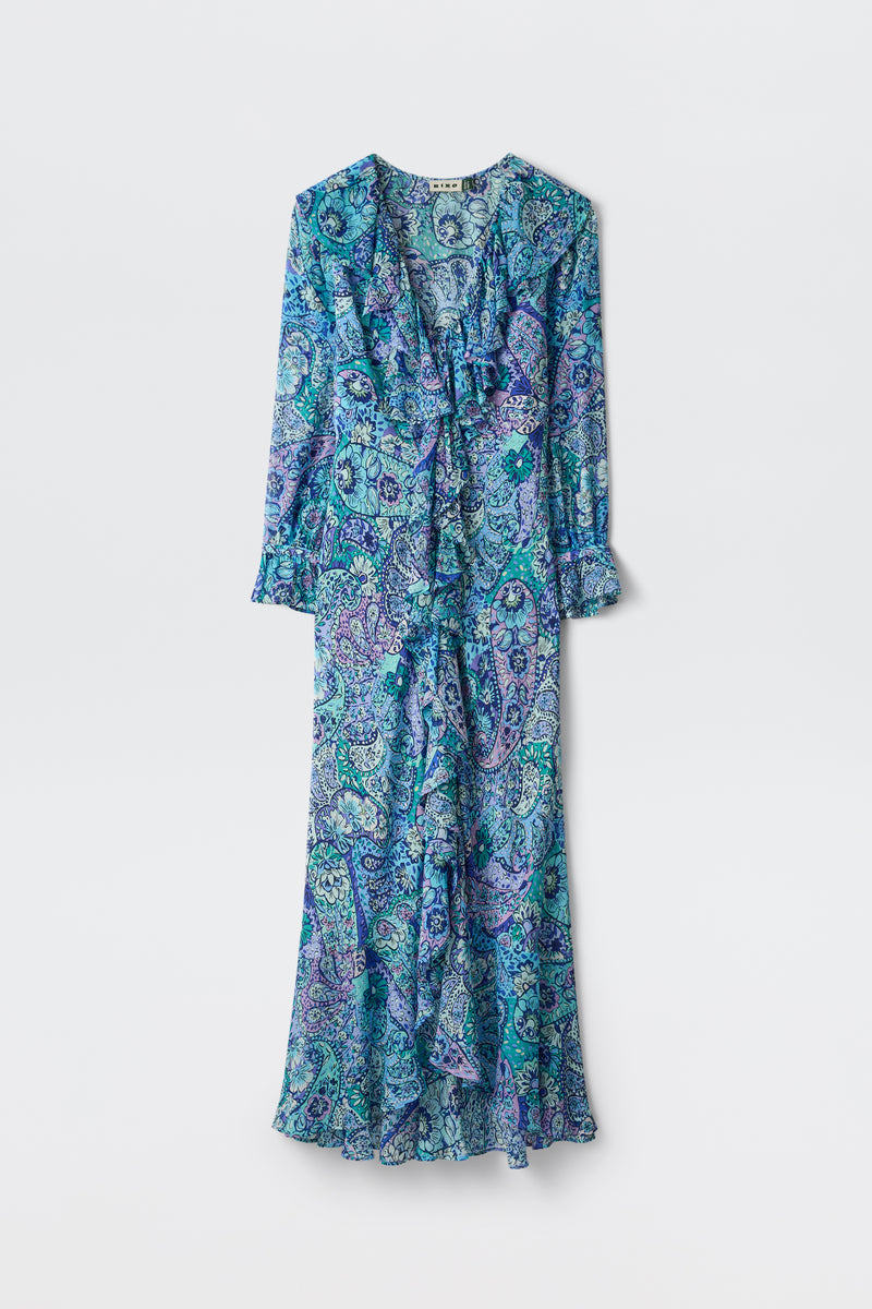 The Gracye - Paisley Floral Blue is a long-sleeved, ankle-length dress featuring a blue, green, and purple paisley print, ruffled front, V-neckline, and flared hem, shown against a plain white background.