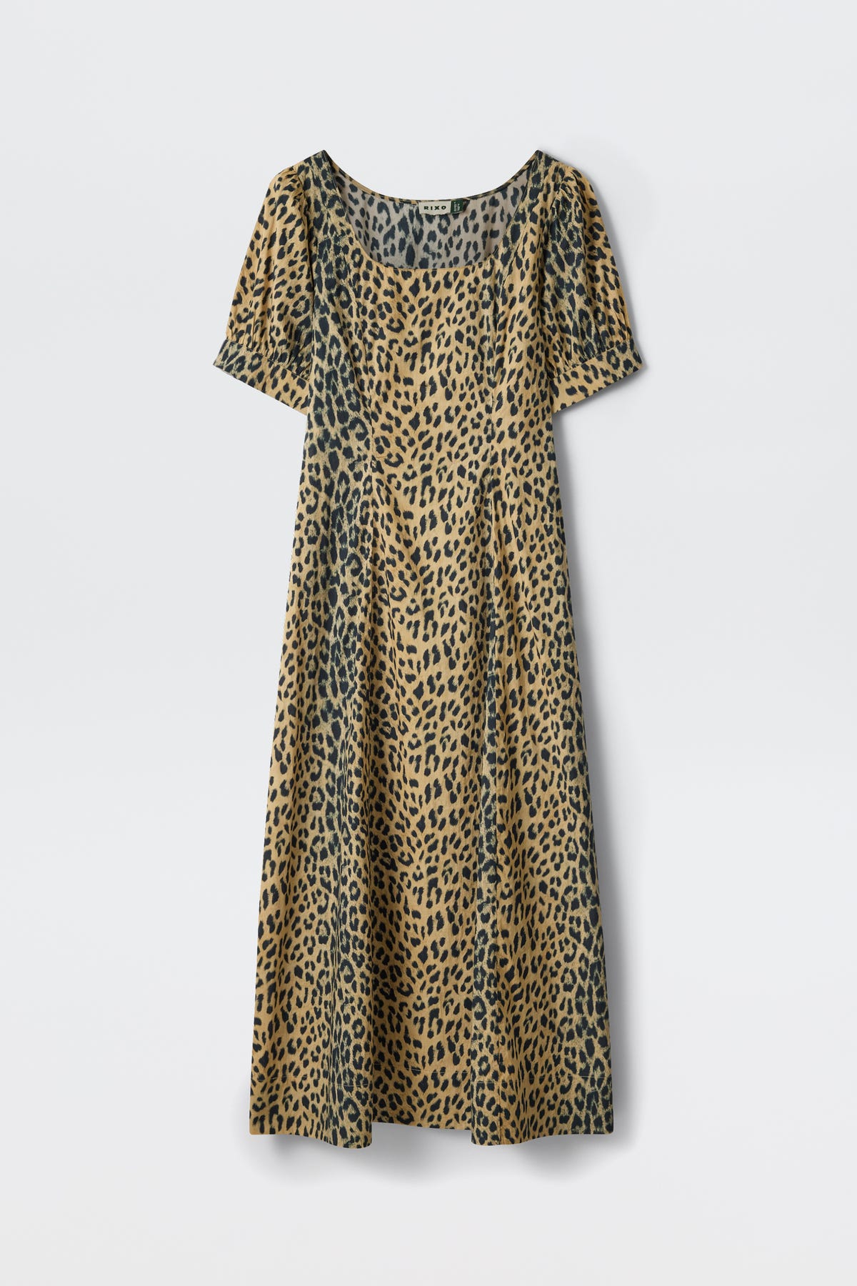 The Kathleen - Nina Leopard Brown is a short-sleeved, calf-length dress with a scoop neckline, featuring a tan and black leopard print, shown against a plain white background.