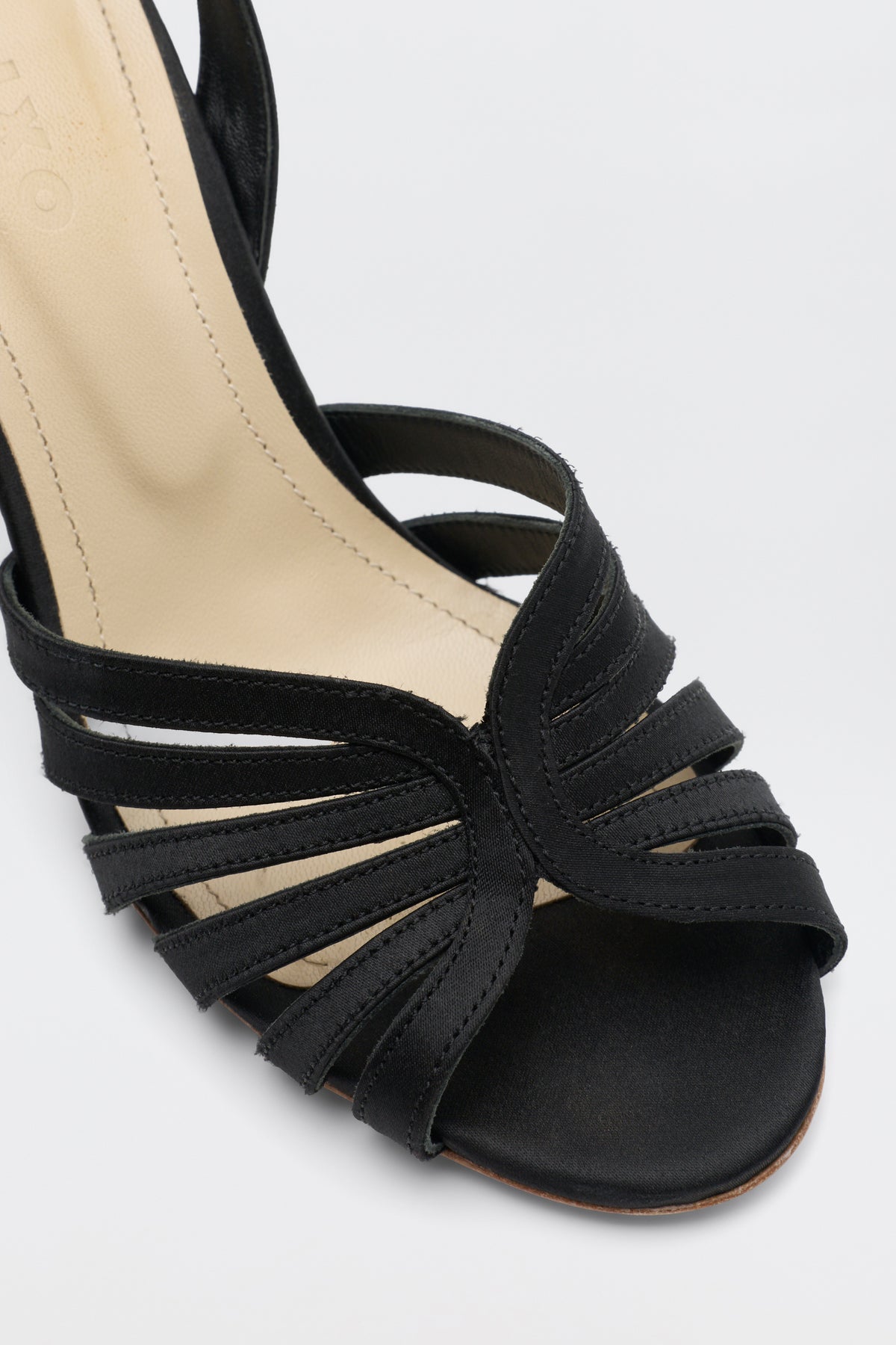 Mavi - Satin Black strappy open-toe heeled sandal with a beige insole.