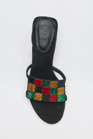 Indie - Multi black sandal with a slingback strap and a band across the toe embellished with a grid of multicolored, square resin tiles.