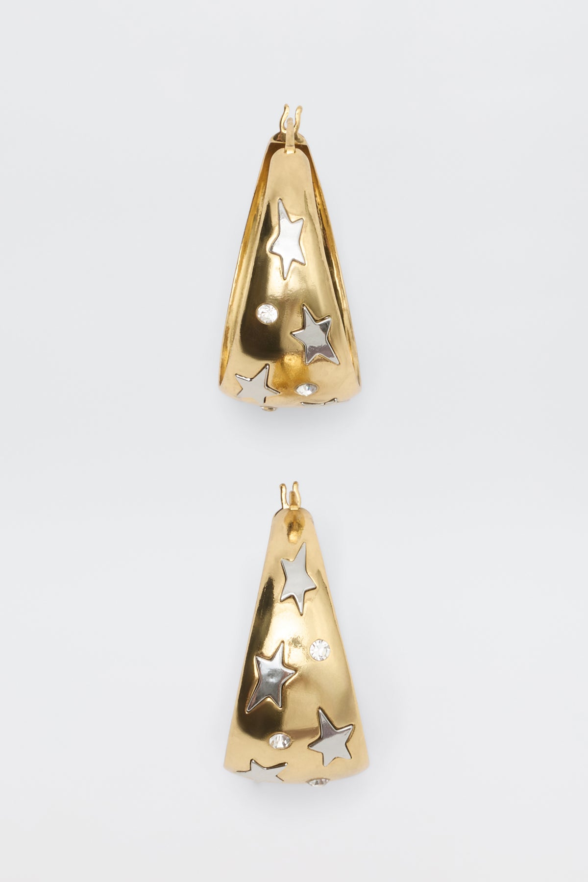 Sergio - Gold hoop earrings featuring cutout star shapes and inset clear stones.