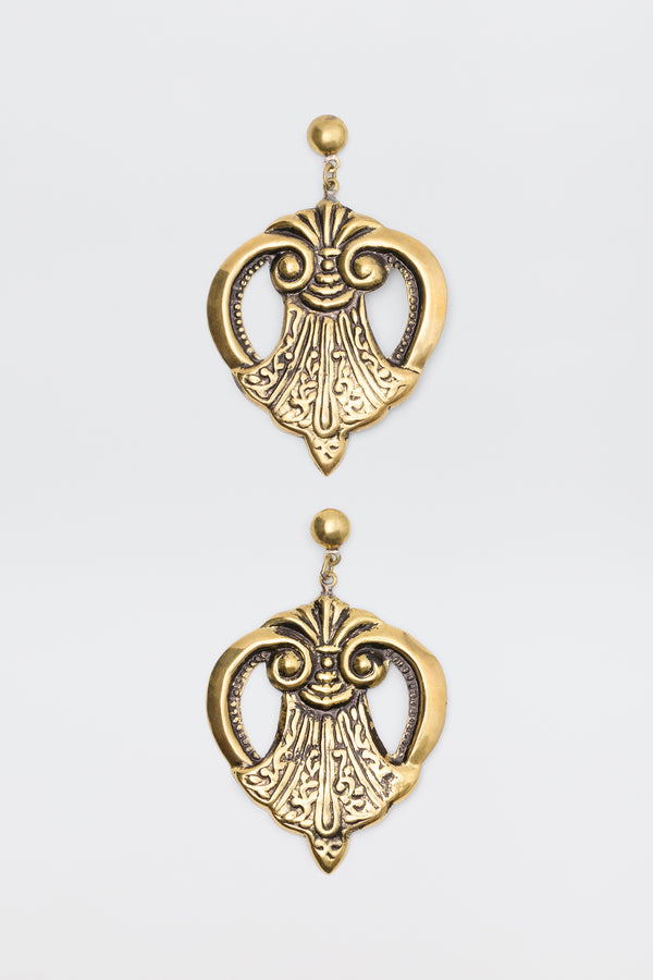 Julieta Earrings Gold featuring ornate, symmetrical scrollwork designs hanging from stud posts.