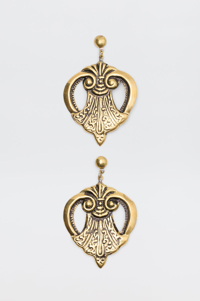 Julieta Earrings Gold featuring ornate, symmetrical scrollwork designs hanging from stud posts.
