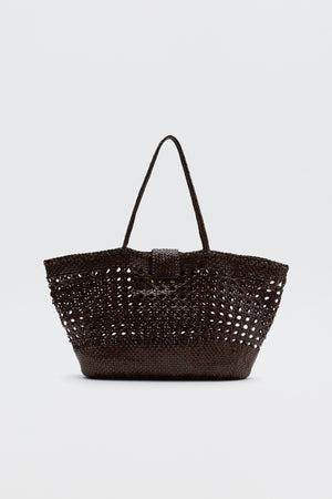 The Lucine - Dark Brown by Dragon Diffusion is a leather woven tote featuring two handles, an open-top design, and a textured, slightly see-through pattern, shown against a plain white background.