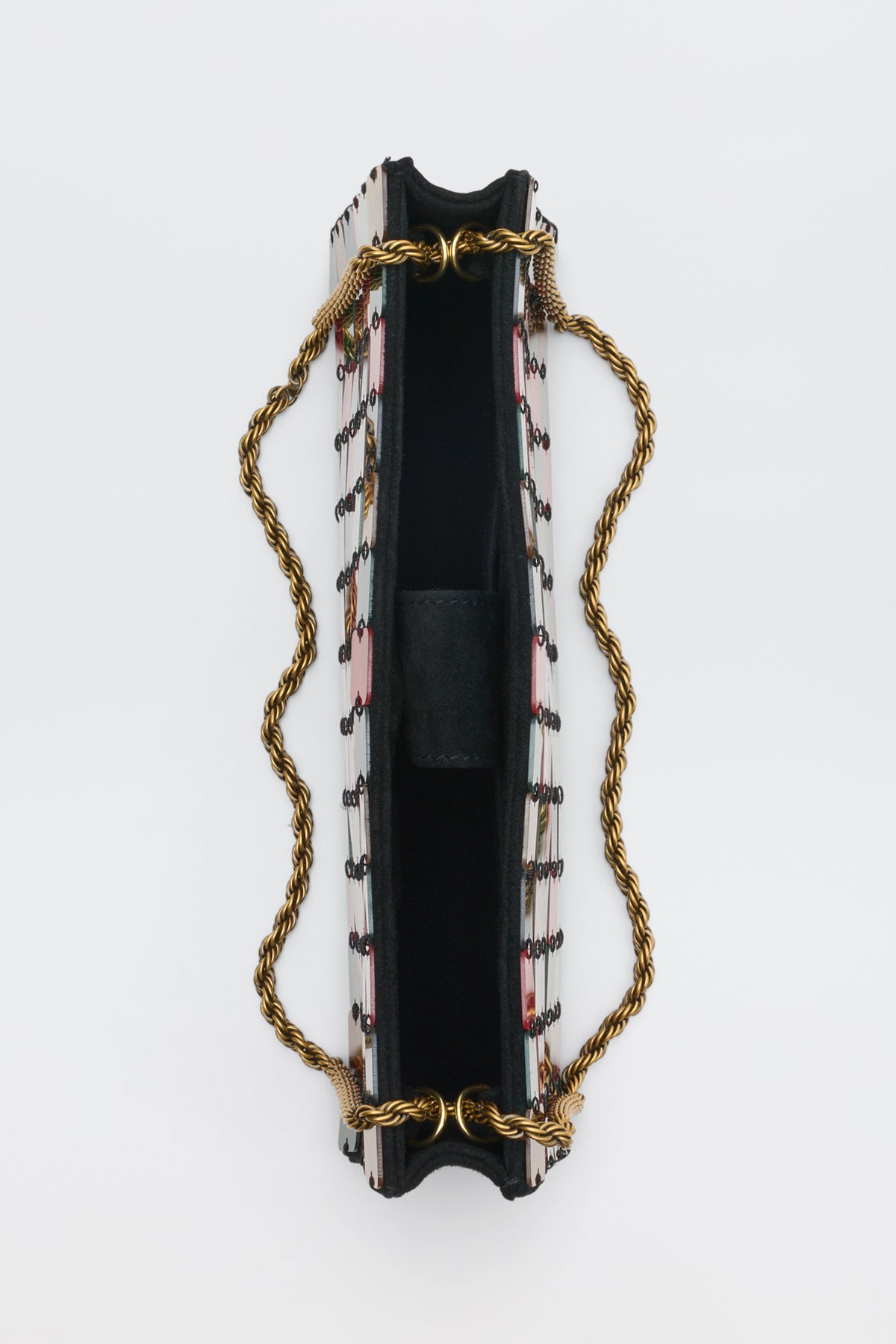 Top-down view of a Gracelyn - Multi rectangular, patterned clutch bag with a gold-tone chain strap.