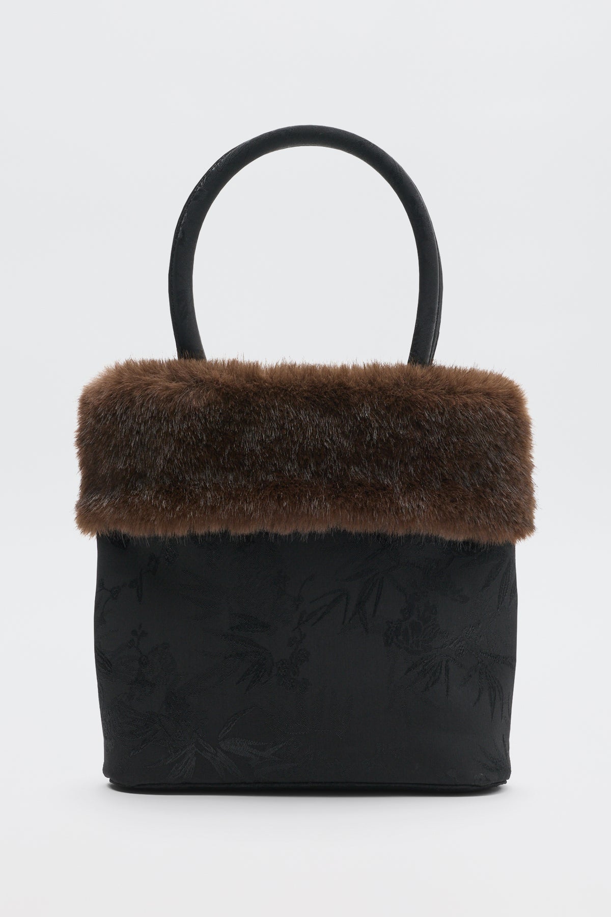 Gabbie - Black handbag with a brown faux-fur trim and a single top handle.