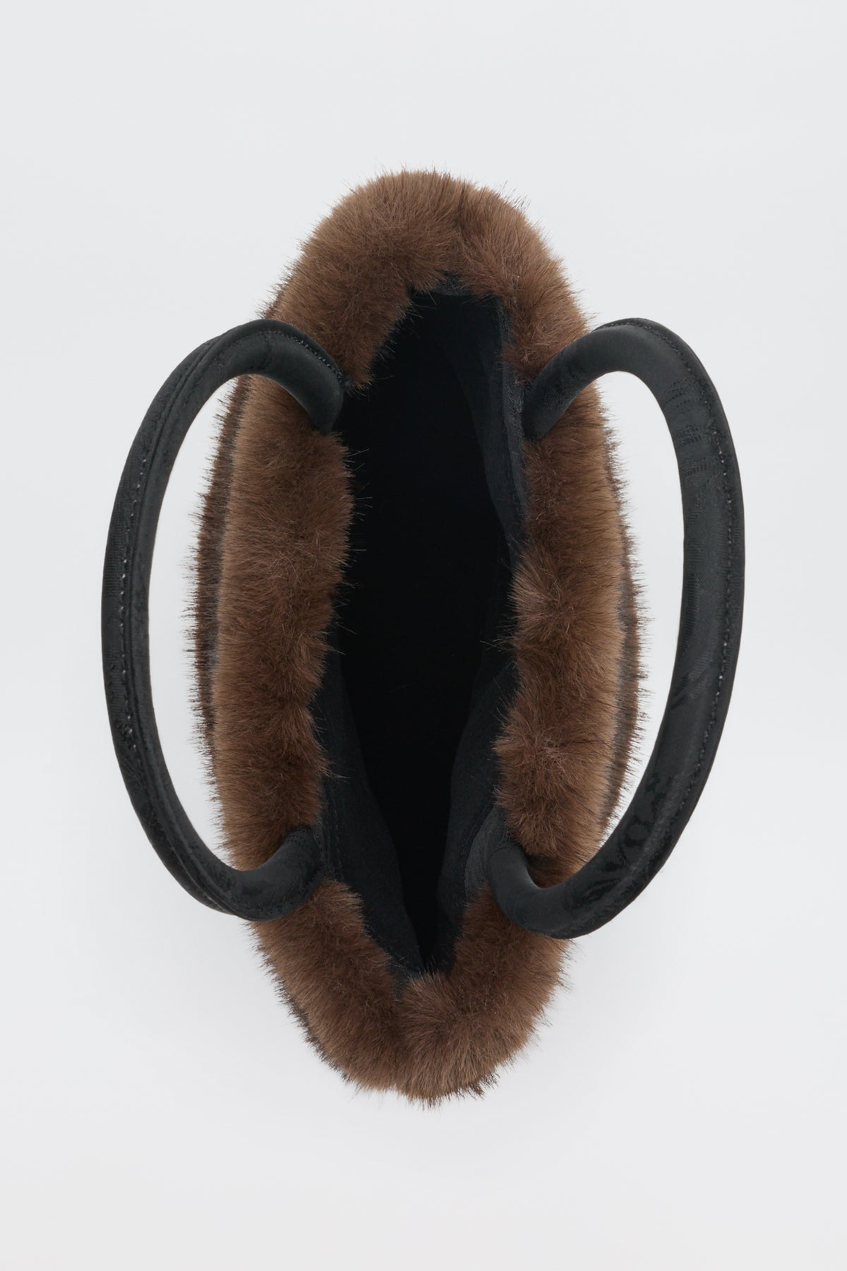 Top-down view of the Gabbie - Black faux-fur tote bag with two black circular handles.