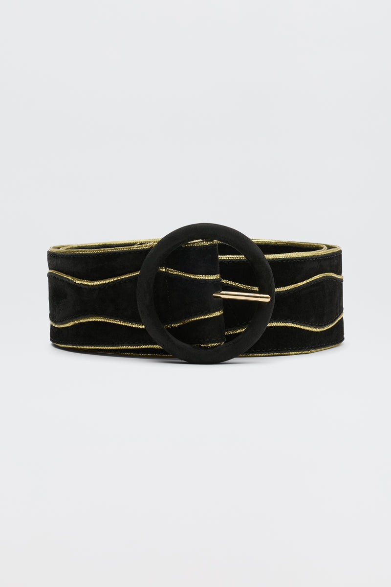 The Catalina - Black and Gold is a sueded cow leather belt with subtle gold wavy lines and a large round black buckle, shown against a plain light background.