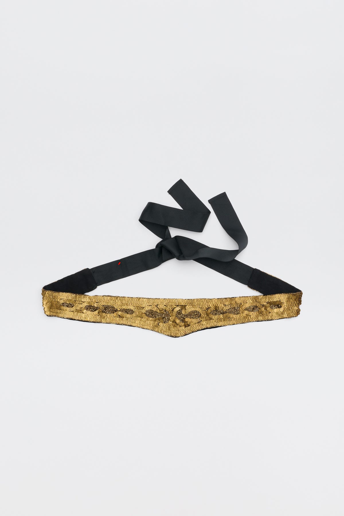 Rorie - Vintage Flora Embellishment Antique Gold belt, featuring gold sequins and a black fabric tie, laid flat on a white background.