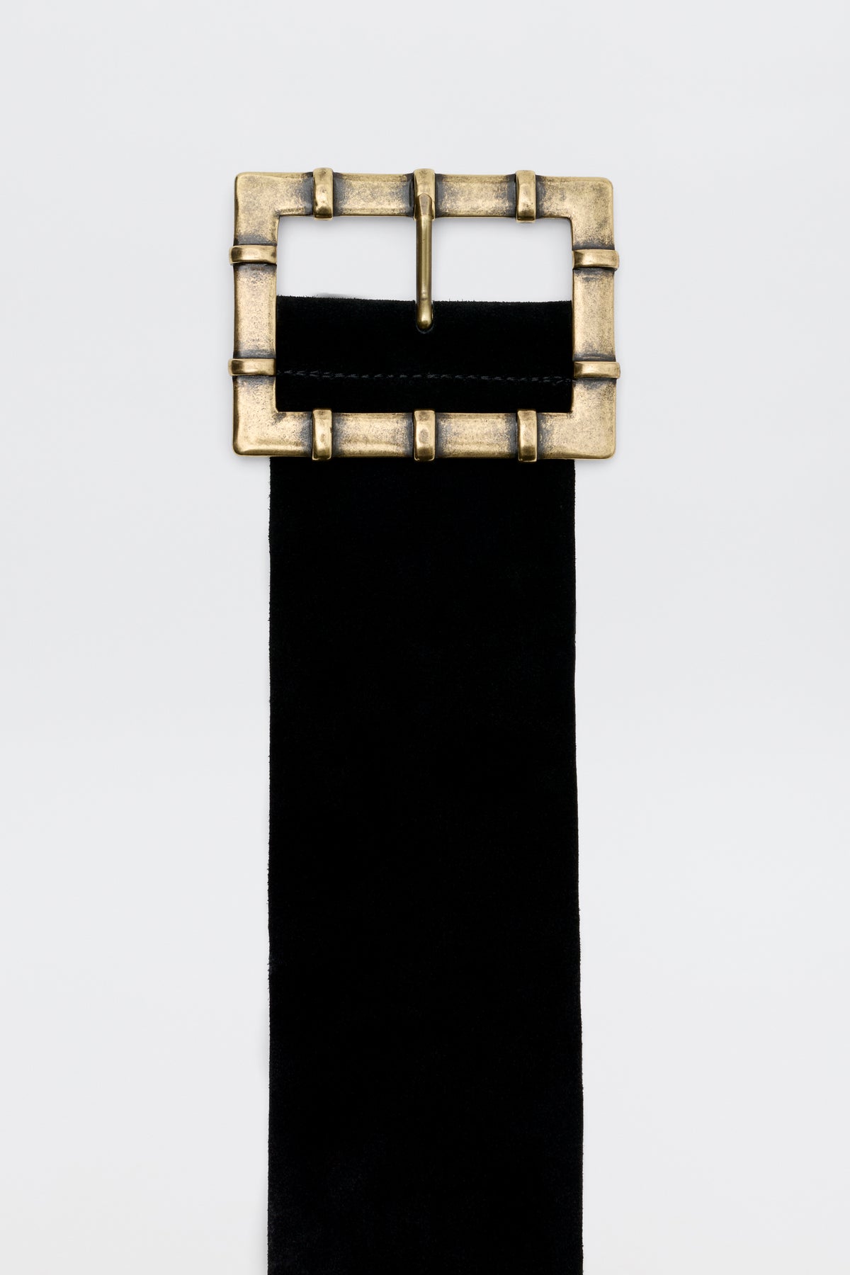 Helga - Black belt with a large, rectangular, antique-style brass buckle.