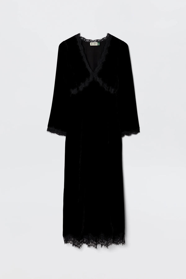 The Alessi - Black is a long-sleeved black velvet dress with boho-glam lace detailing on the neckline, sleeves, and hem, shown against a plain light background.