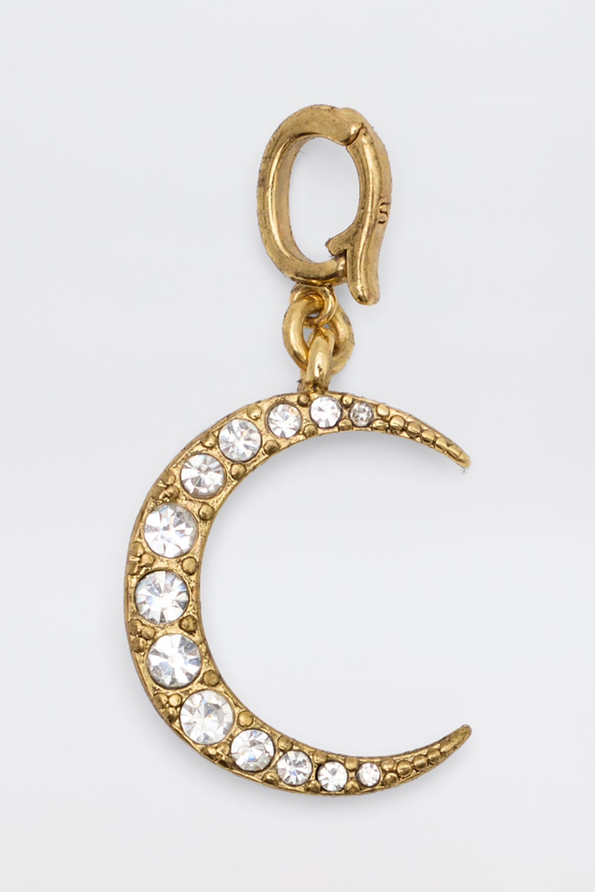 Samie Charm Gold, a crescent moon-shaped gold charm adorned with clear gemstones and attached to a small gold clasp, displayed against a plain white background.