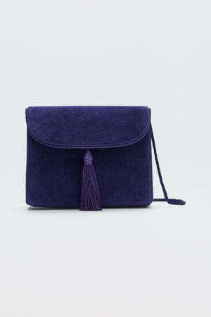 Jeany - Purple suede shoulder bag featuring a fold-over flap, a central tassel, and a thin strap.