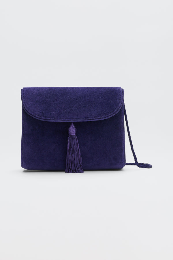 Jeany - Purple suede shoulder bag featuring a fold-over flap, a central tassel, and a thin strap.