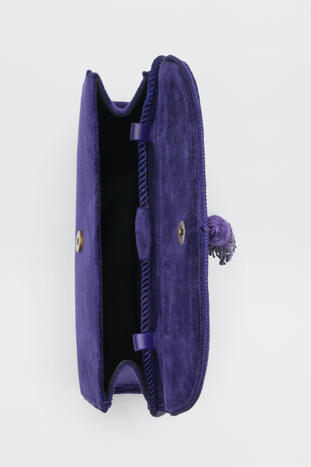 Open Jeany - Purple clutch with a tassel and gold-tone snap closure.