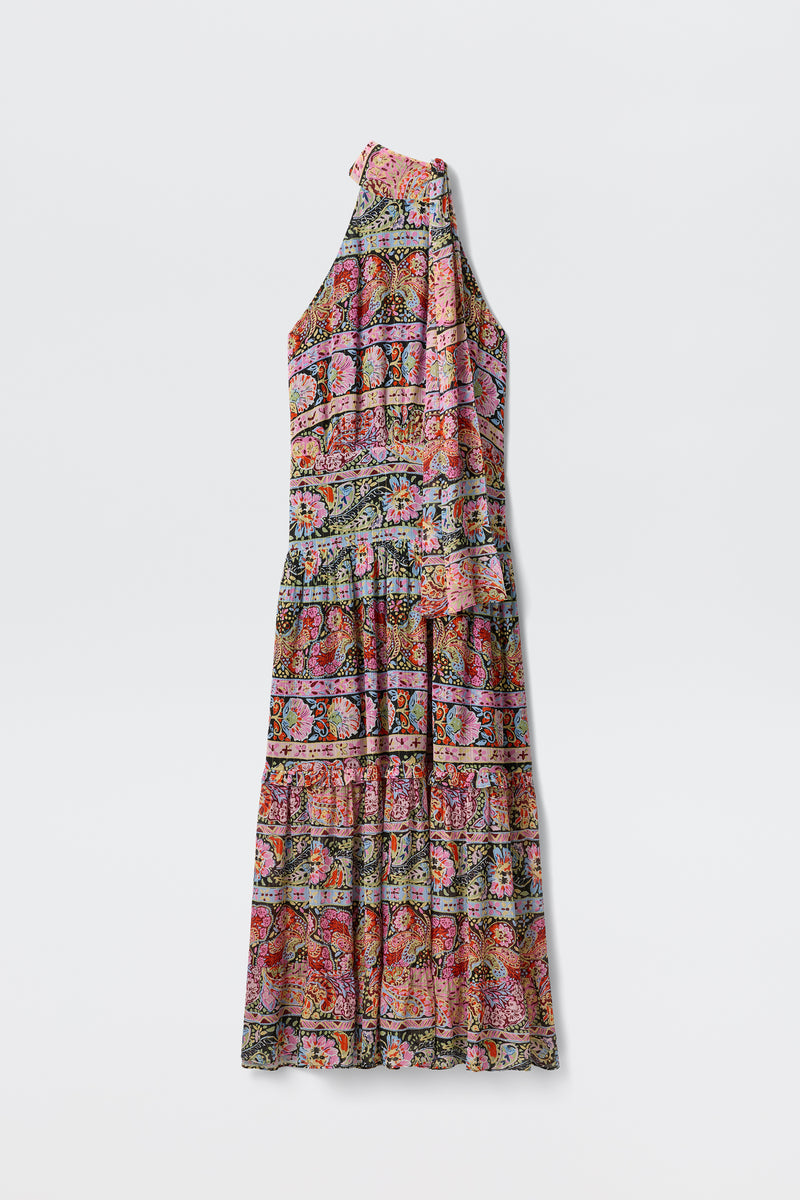 The Abi - Cara Stripe Black is a sleeveless, ankle-length dress with stripes, a high neckline with tie detail, and a tiered skirt, shown on a plain white background.