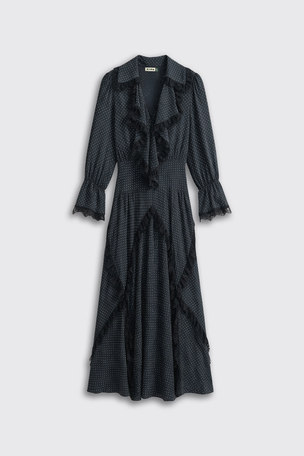 Aerin - Micro Polka Dot Black midi dress with white polka dots, featuring a ruffled V-neckline, long sleeves with ruffled cuffs, and vertical ruffle trim along the skirt.