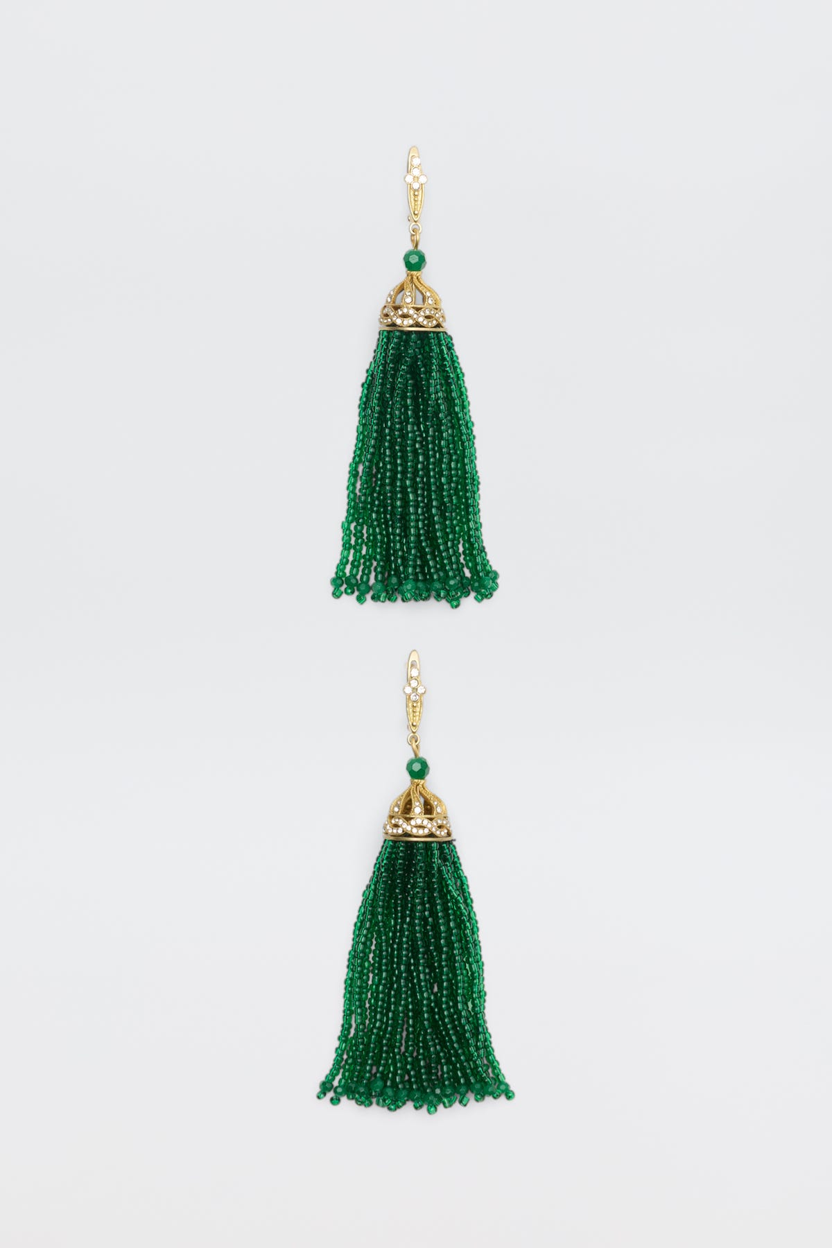 Alea - Green earrings featuring gold caps with clear stones and long, green beaded tassels.