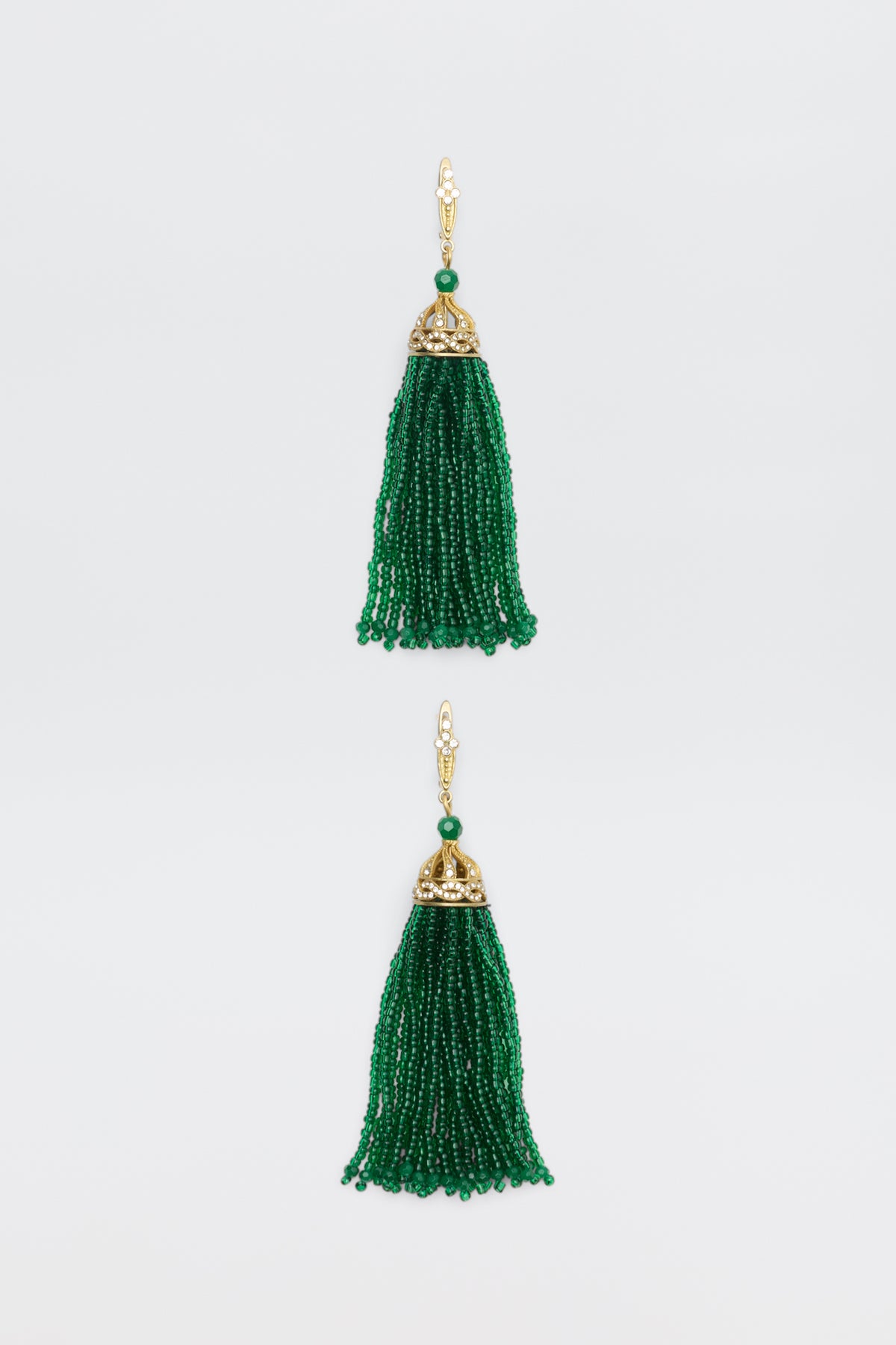 Alea - Green earrings featuring gold caps with clear stones and long, green beaded tassels.