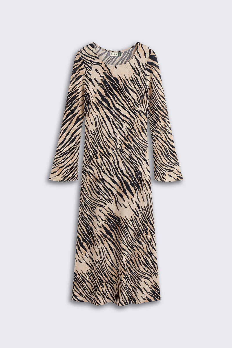 A long-sleeved, knee-length dress named “Amal - Cooper Tiger Beige,” featuring a beige and black zebra stripe pattern, displayed on a plain light gray background.