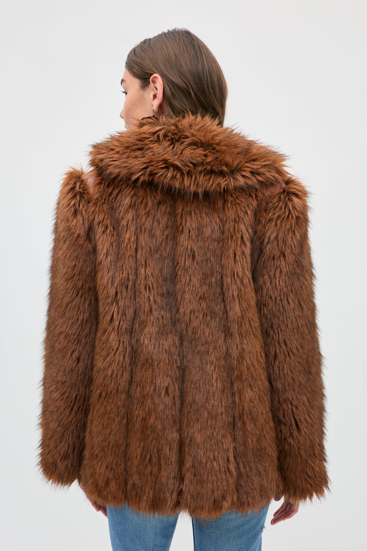 Back view of a person wearing a brown Cybil faux fur coat.
